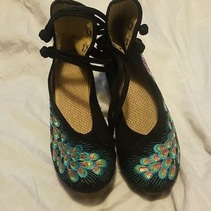 Super cute peacock mary-janes with high back.